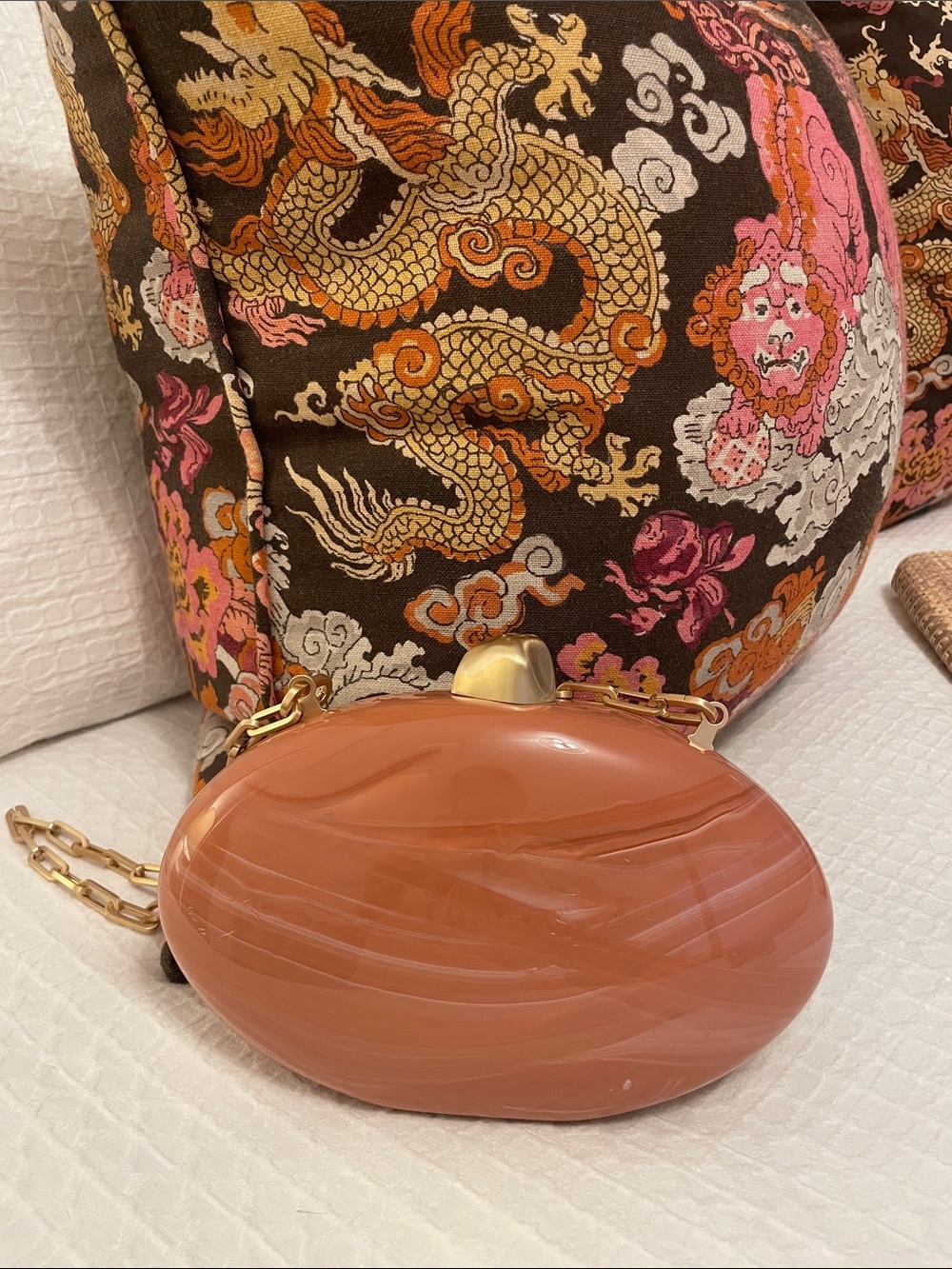 cult gaia glossy terracotta oval clutch with gold hardware